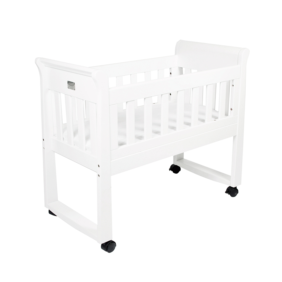 white bassinet on wheels